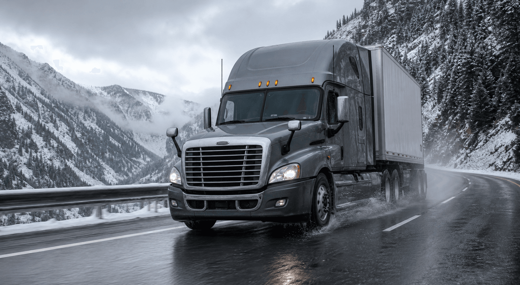 Commercial semi truck operating on a snowy freight route